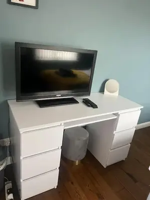 a white desk with a television on top of it at Birkdale's Hidden Gem in Southport
