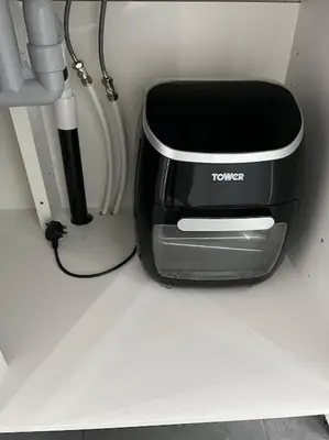 a black and silver toaster sitting on a counter at Birkdale's Hidden Gem in Southport
