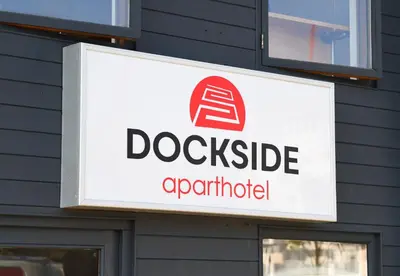 a sign on a building with a dog whistle apparatus at Dockside Aparthotel, Best Western Signature Collection in Liverpool