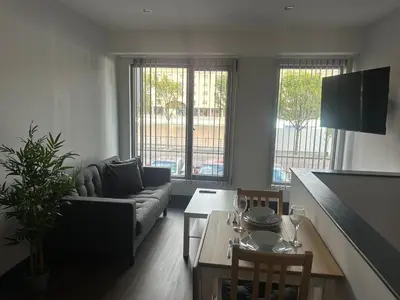 a living room with a couch and a table at Dockside Aparthotel, Best Western Signature Collection in Liverpool