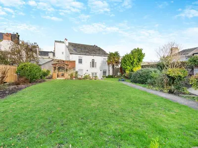 a large white house with a large yard at Uk46866 - Hawkshead in Ulverston