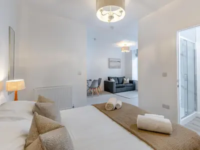 a bedroom with a large bed with towels on it at Uk46866 - Hawkshead in Ulverston