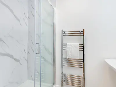 a shower with a glass door in a bathroom at Uk46866 - Hawkshead in Ulverston