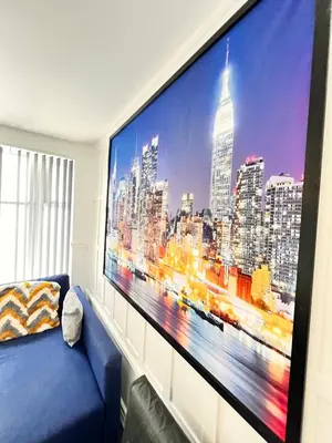 a large flat screen tv on a wall in a living room at The Brooklyn loft apartment in Blackpool