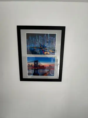a framed picture of a city on a wall at The Brooklyn loft apartment in Blackpool