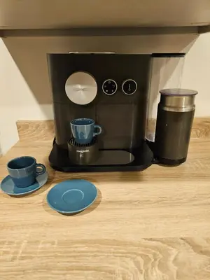 a coffee maker with two cups on a wooden table at 8 Berth Caravan Haven Marton Mere in Blackpool