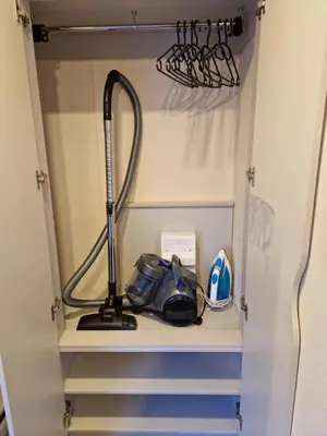 a hutch with a hair dryer on a shelf at 8 Berth Caravan Haven Marton Mere in Blackpool
