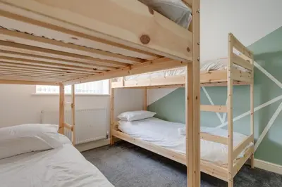 a bunk bed room with two bunk beds at Huge Apartment - 8 Beds - Free Parking - Long Stays! in Liverpool