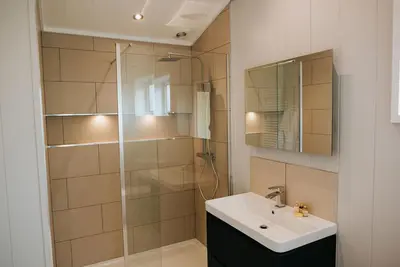 a bathroom with a sink and a glass shower at Nash - Bowland Retreat Lodges Clitheroe, Ribble Valley, Lancashire in Clitheroe