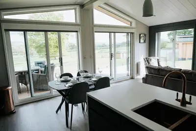 a living room with a table and a couch at Nash - Bowland Retreat Lodges Clitheroe, Ribble Valley, Lancashire in Clitheroe