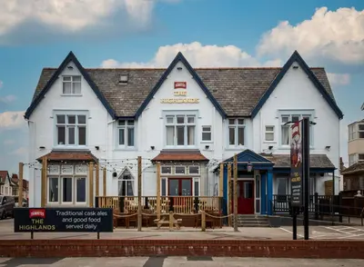 a large white building on the corner of a street at The Highlands, Bispham in Blackpool
