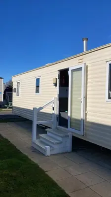 a white rv with a staircase leading to its door at A fully equiped caravan Marton mere haven in Blackpool