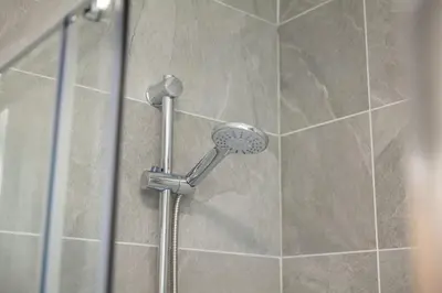 a shower with a shower head in a bathroom at Host & Stay - The Quarter in Liverpool