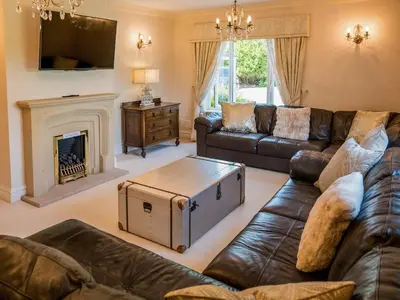 a living room with a couch and a fireplace at The Farmhouse At Ream Hills in Weeton