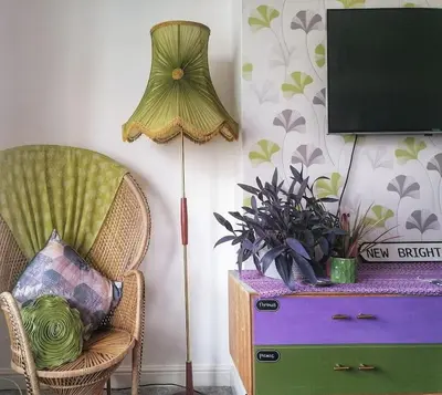 a room with a lamp and a chair and a tv at Aqua View, New Brighton Beach- 2 Bedroom with BALCONY & VIEW in New Brighton