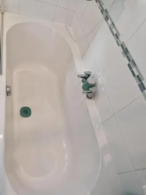 a white toilet in a bathroom with a faucet at Aqua View, New Brighton Beach- 2 Bedroom with BALCONY & VIEW in New Brighton