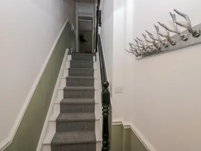 a staircase in a building with a stair case at Willow Cottage in Carnforth
