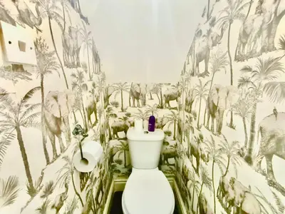 a bathroom with a toilet with a mural of animals at Liverpool 4 Bed Home Sleeps 18 Free Parking in Liverpool