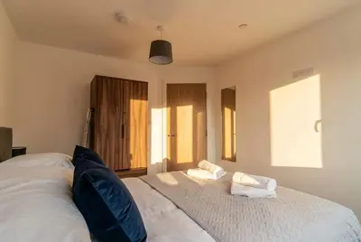 a bedroom with a large white bed with two pillows at Fantastic 1 Bed Central Preston Apartment in Preston