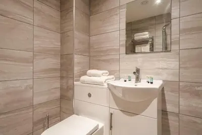 a bathroom with a white toilet and a sink at Fantastic 1 Bed Central Preston Apartment in Preston