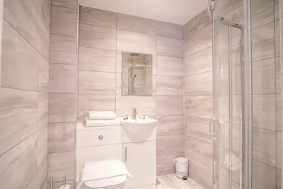 a bathroom with a toilet and a sink and a shower at Fantastic 1 Bed Central Preston Apartment in Preston