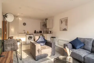 a living room with a couch and a table at Fantastic 1 Bed Central Preston Apartment in Preston