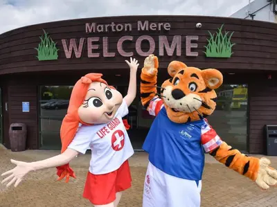 two people dressed up in mascots in front of a store at Elite Retreat Blackpool in Blackpool