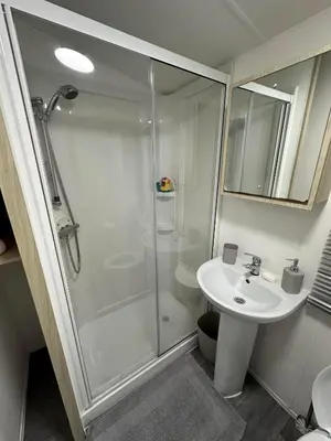 a bathroom with a shower and a sink at Elite Retreat Blackpool in Blackpool