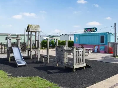 a playground with a slide at Peachy in Heysham