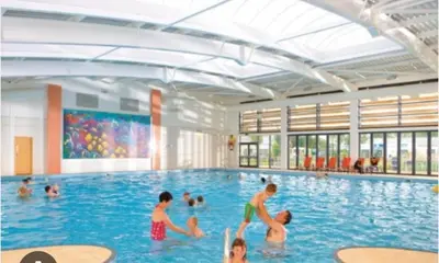 a group of people in a swimming pool at Vinchella-3 bedroom caravan in Grange Over Sands