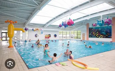a group of people in a swimming pool at Vinchella-3 bedroom caravan in Grange Over Sands