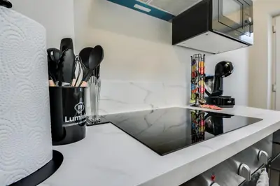 a kitchen counter with a sink and utensils at Ripon By Serene Stays Stylish Liverpool Home Sleeps 5 with Free Parking Fast WiFi and Close to Stadiums in Liverpool