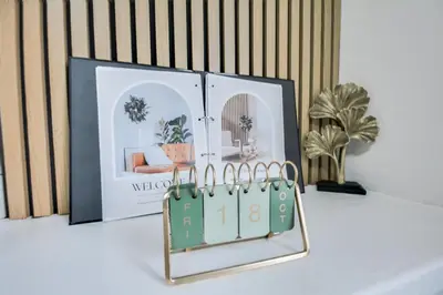 a shelf with two pictures of a living room at Ripon By Serene Stays Stylish Liverpool Home Sleeps 5 with Free Parking Fast WiFi and Close to Stadiums in Liverpool