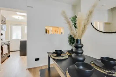 a living room with a table with a vase on it at Ripon By Serene Stays Stylish Liverpool Home Sleeps 5 with Free Parking Fast WiFi and Close to Stadiums in Liverpool