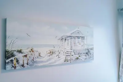 a painting of a white house on the beach at Trent House - Quality 3 Bedroom House Lytham in Brown Moss Side