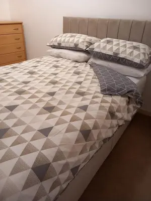 a bed with two pillows on top of it at Cable House, Liverpool City Centre in Liverpool