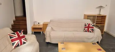 a living room with a couch and a coffee table at Cable House, Liverpool City Centre in Liverpool
