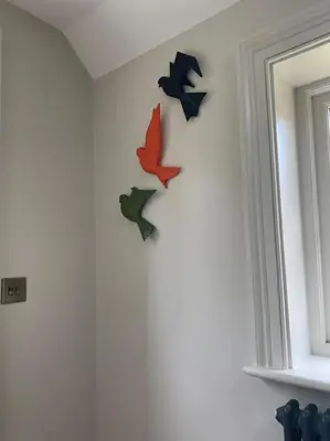a group of four birds on a wall at The Bothy Cottage in Lytham St Annes