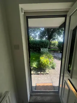 an open door with a view of a yard at Cozy 3-Bedroom House in Bolton, Huge Garden in Egerton