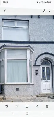 a house with a large window and a door at The White House in Barrow in Furness
