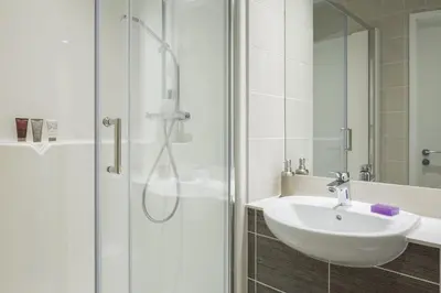 a bathroom with a sink and a shower at Studio In Central Liverpool, Free Breakfast in Liverpool