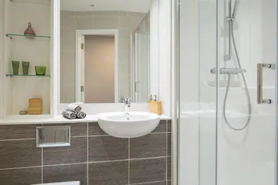 a bathroom with a sink and a shower at Studio In Central Liverpool, Free Breakfast in Liverpool