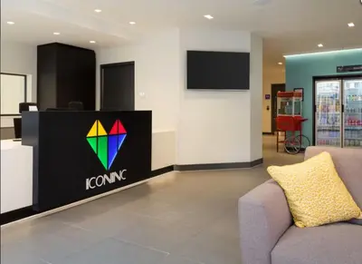 a lobby with a koma sign and a couch at Studio In Central Liverpool, Free Breakfast in Liverpool