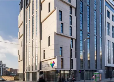 a tall building with a sign on the side of it at Studio In Central Liverpool, Free Breakfast in Liverpool