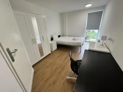 a room with a desk and a room with a bed at Cosy Budget En-suites, Optional Kitchen, Liverpool in Liverpool