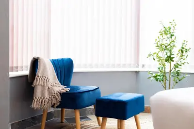a room with two blue chairs and a window at Eco-Friendly Stay in Barrow-In-Furness, Lake District in Barrow in Furness