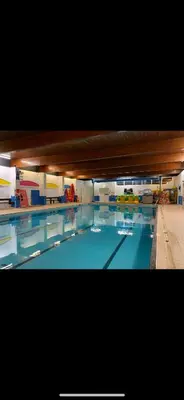 a large swimming pool with a large blue pool at Seaside breaks morcambe in Heysham