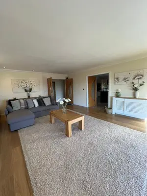 a living room with a blue couch and a coffee table at The View in Oswaldtwistle