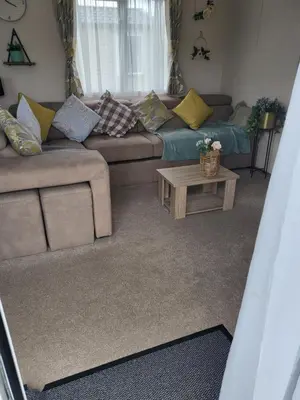 a living room with a couch and a coffee table at Angie stunning holiday home in Heysham