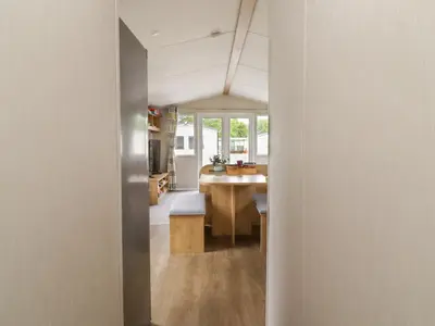 a view of a kitchen from the hallway of a house at Windermere Lodge in Morecambe